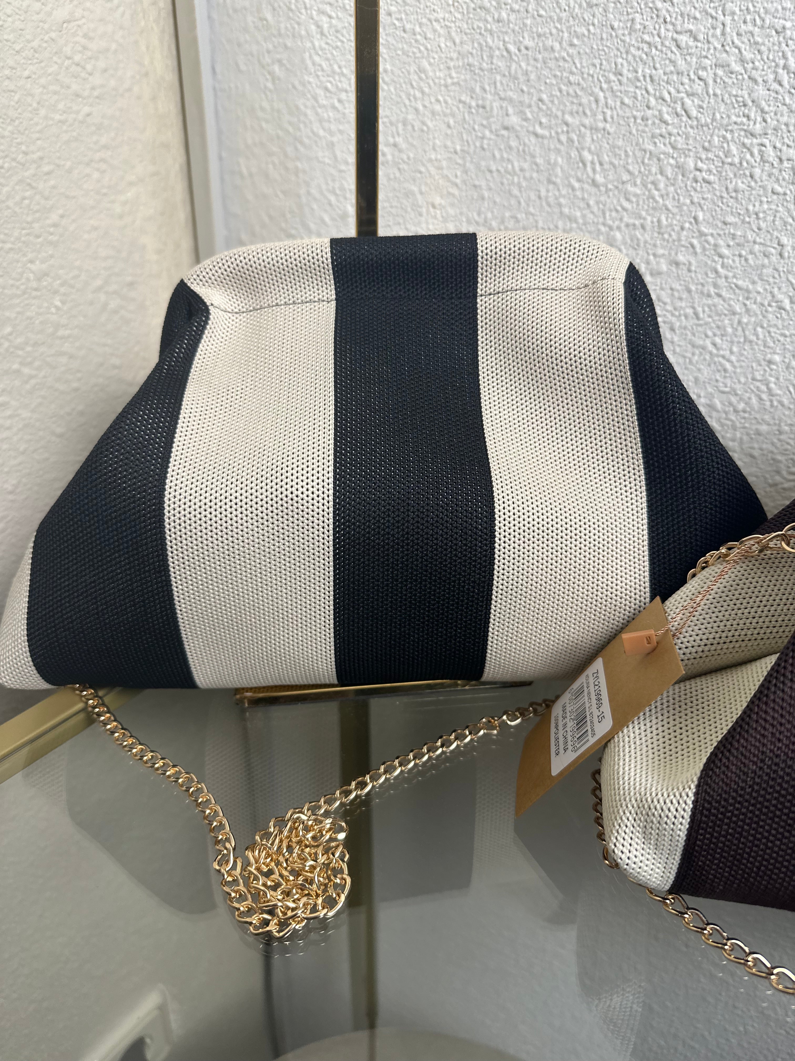 BOLSO CLUTCH RAYAS